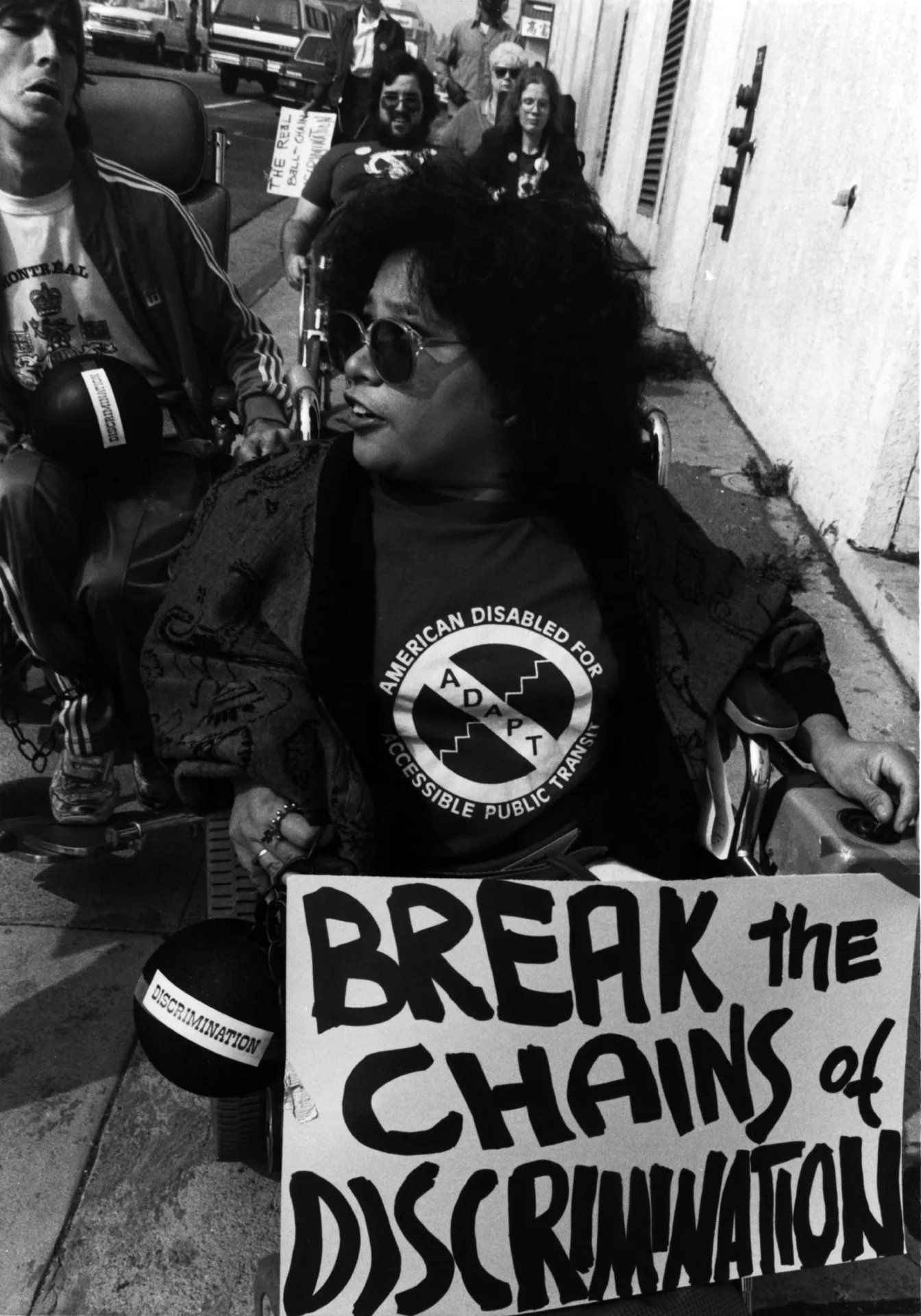 Break the Chains of Discrimination protest sign carried by a protestor, in Los Angeles when Randy Horton, Lillibeth Navarro and Nancy Becker Kennedy were arrested at a protest decrying the budget cuts.