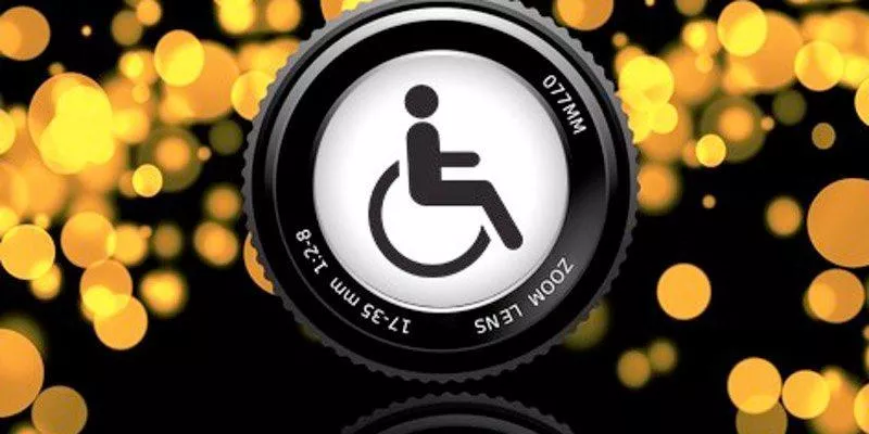 A digital camera lens displaying an international wheelchair symbol.